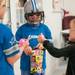 (center) Summer Paplin, 9 of Canton, compares toys in her goody bag after the Harold and Kay Peplau Therapeutic Riding Center's Halloween Trick-or-Treat horse ride. (Tanya Moutzalias for AnnArbor.com)